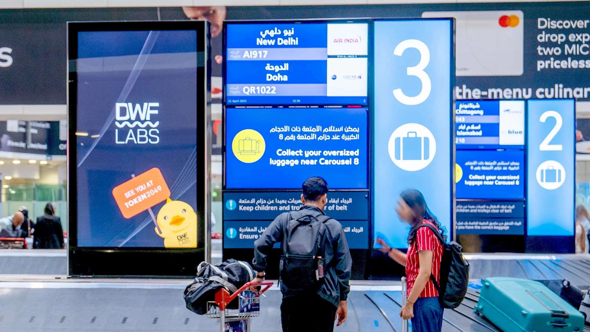 Programmatic airport advertising campaign at Dubai International (DXB) Airport featuring premium digital out-of-home media for DWF Labs